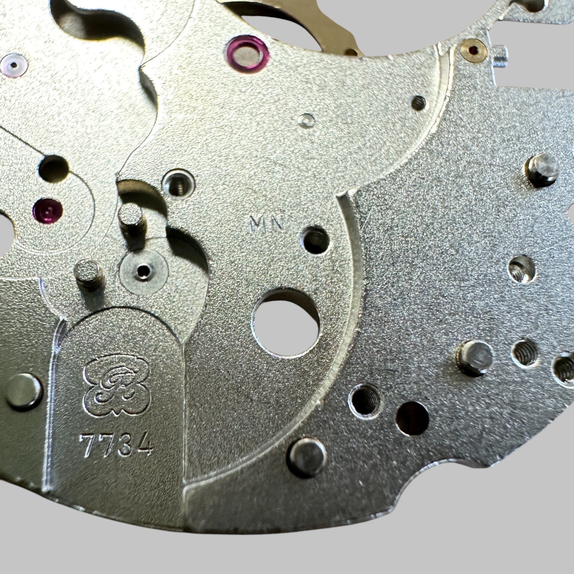 Back of Genuine original vintage mainplate jewelled from HEUER for caliber X 7734 referenced with nomenclature 100