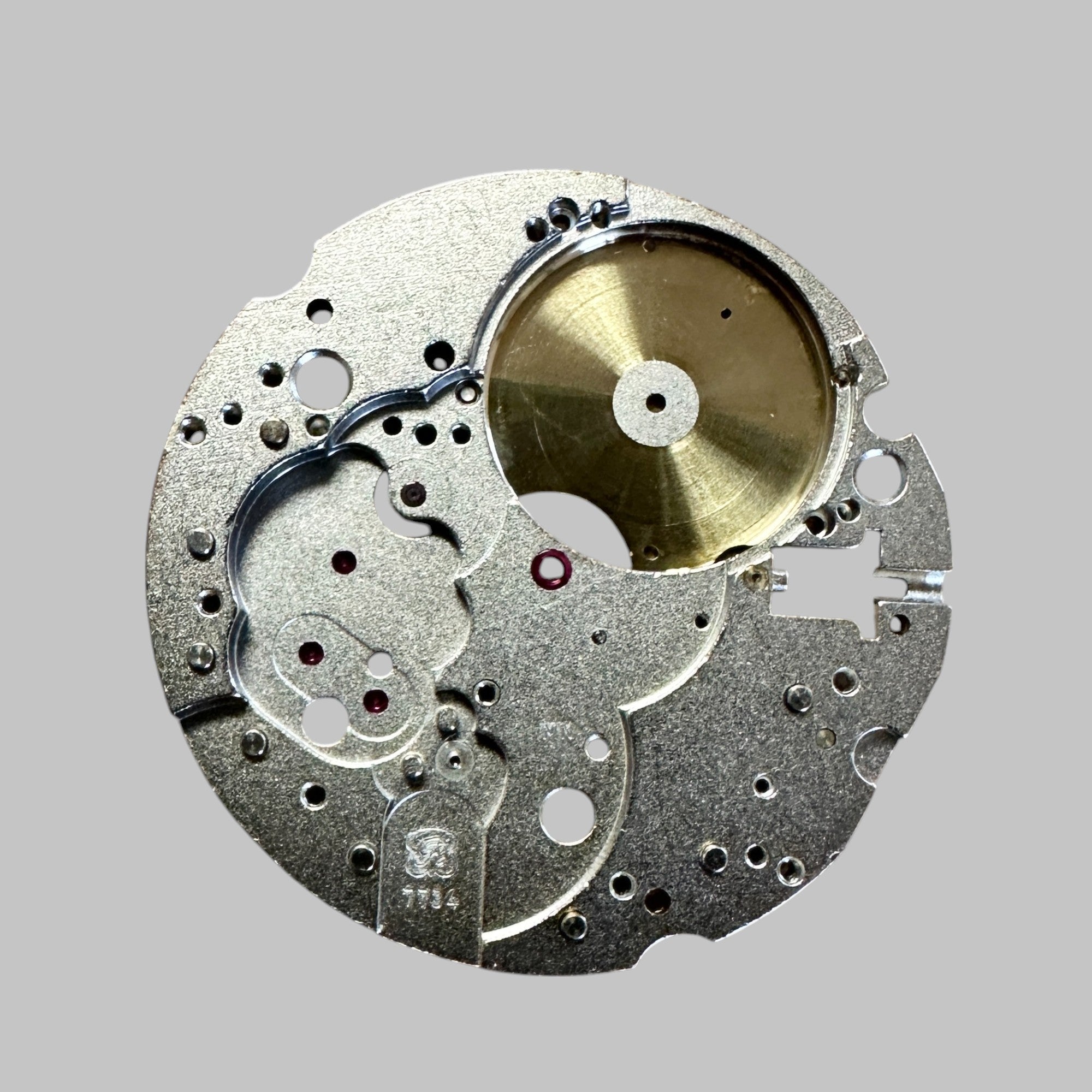 Genuine original vintage mainplate jewelled from HEUER for caliber X 7734 referenced with nomenclature 100