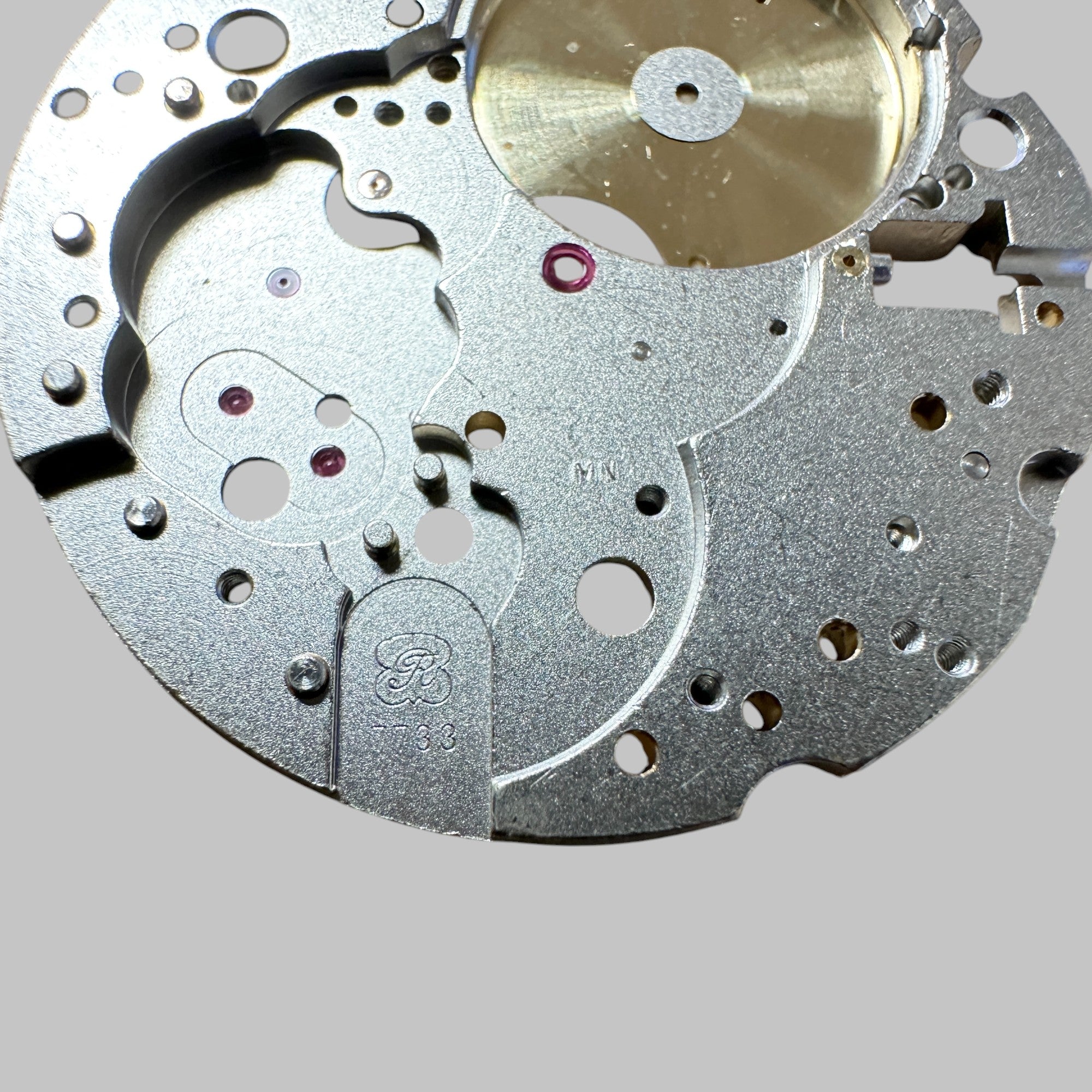 Back of Genuine original vintage mainplate jewelled from HEUER for caliber 7733