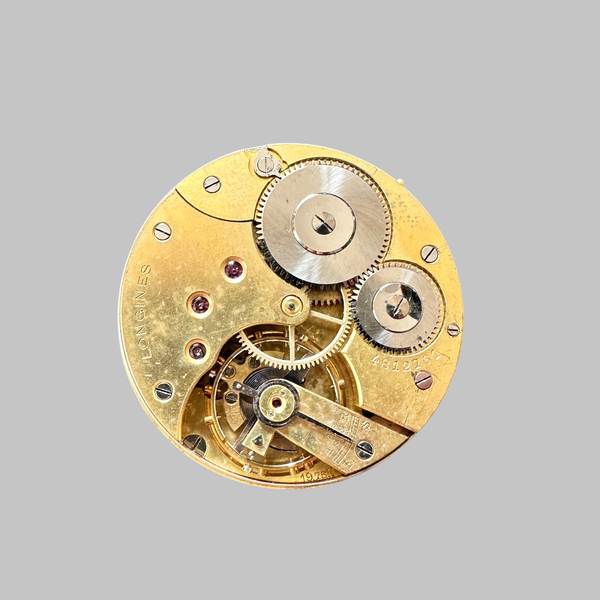Genuine original vintage movement with dial from Longines for caliber 19.75N - side view