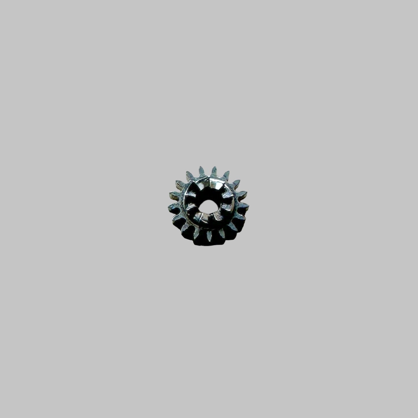 Genuine original vintage winding pinion from Girard-Perregaux for caliber 33L0/3000 referenced with nomenclature 1.03 / 17 TEEH - side view