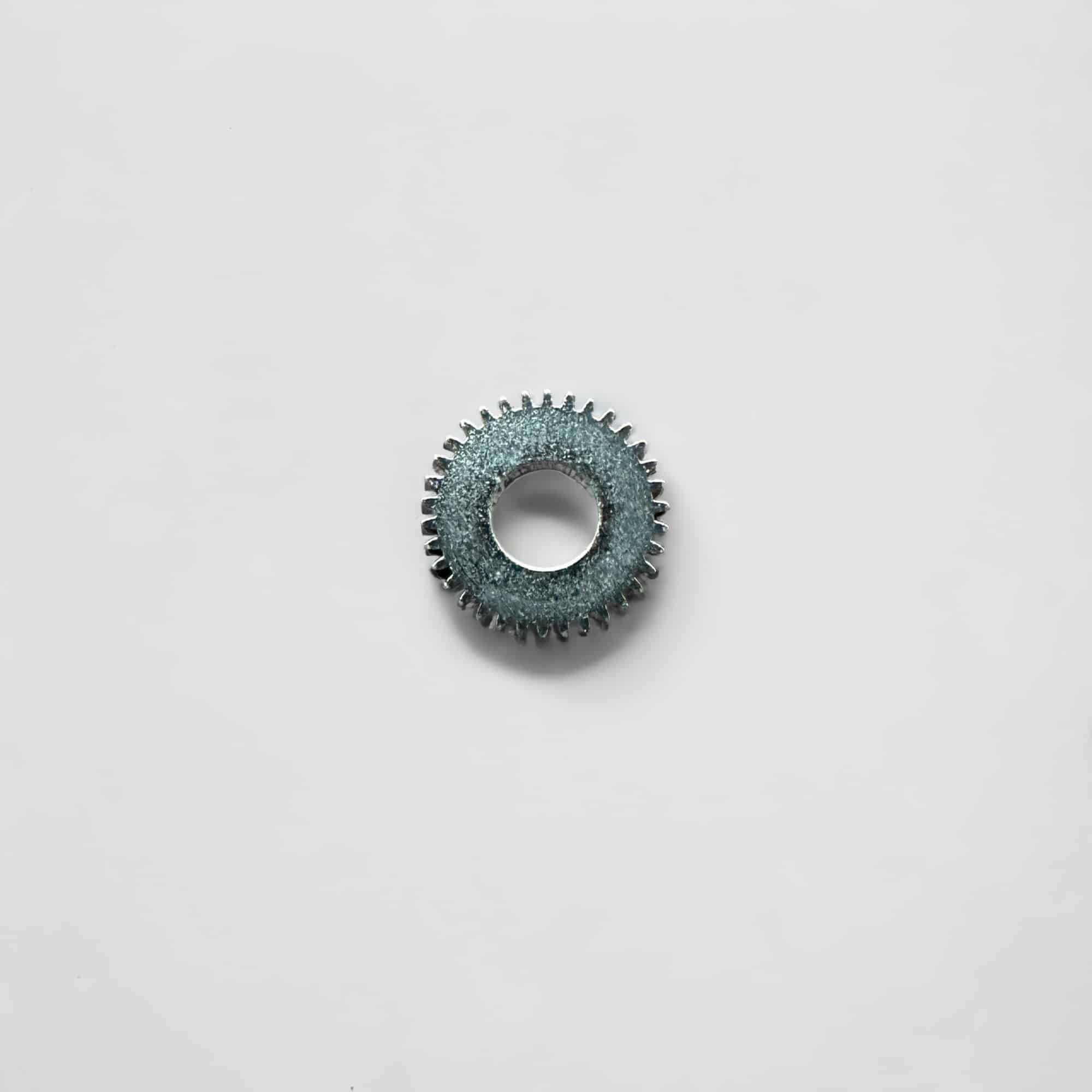 This is a picture of the LEMANIA CAL. 5100 OMEGA 1045 - CROWN WHEEL 1101 watch component.