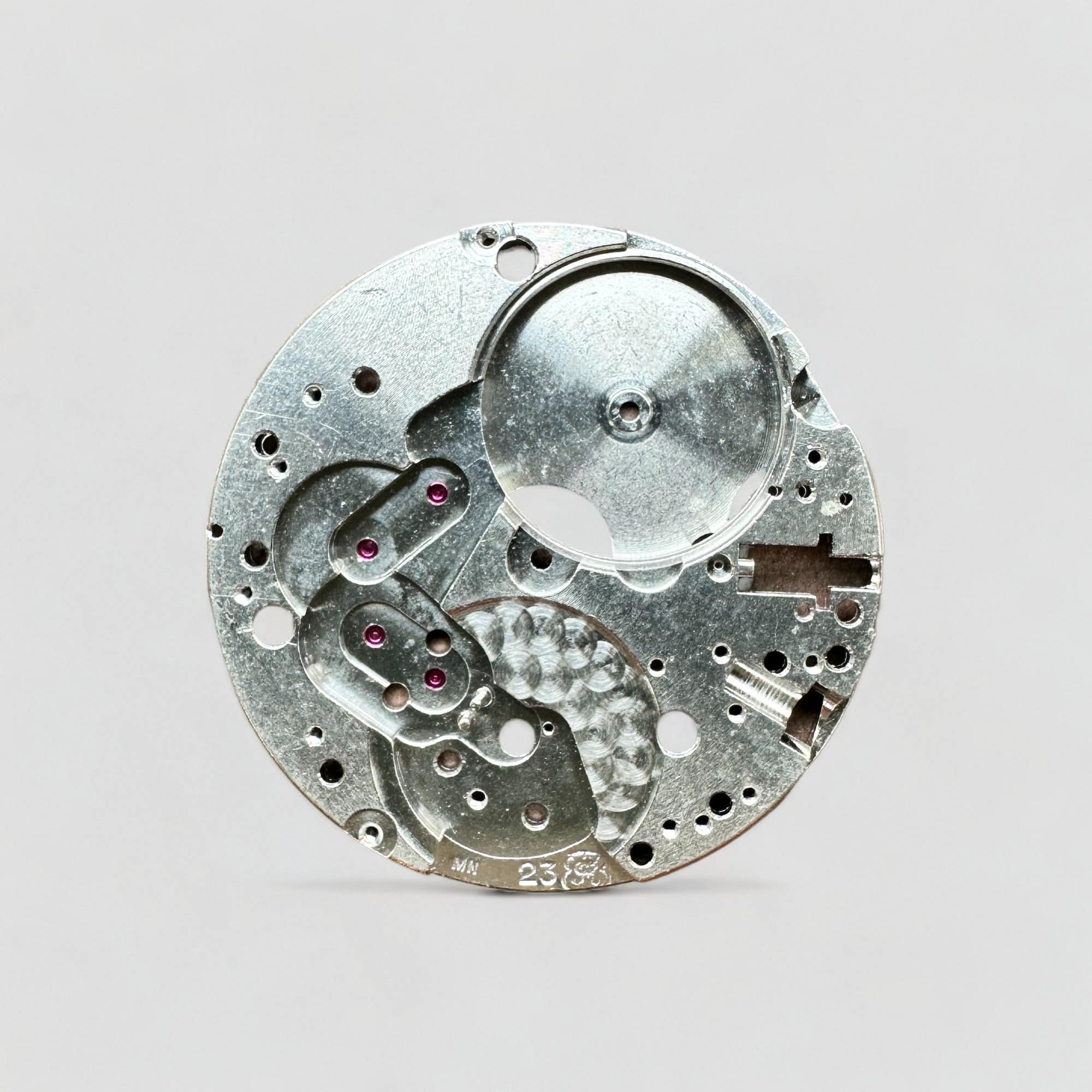 This is a picture of the VALJOUX CAL. 23 - MAINPLATE 23 SIGNED MN 100 watch component.